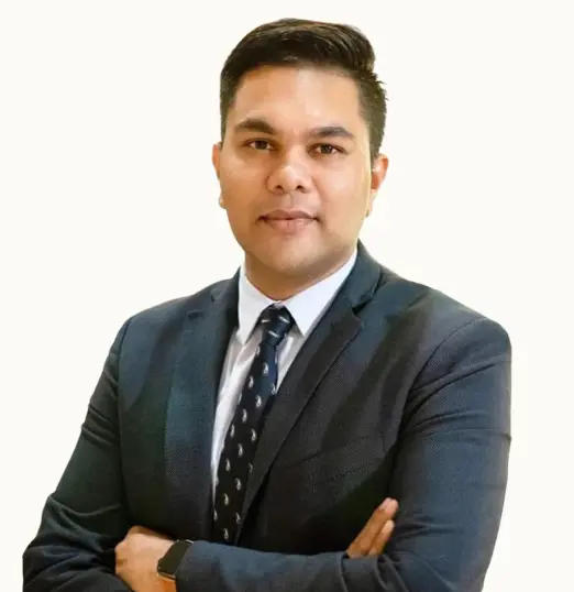 Professional portrait of hospitality lecturer Siddhesh Gawde in a suit, specialising in hotel digital marketing At AIHM
