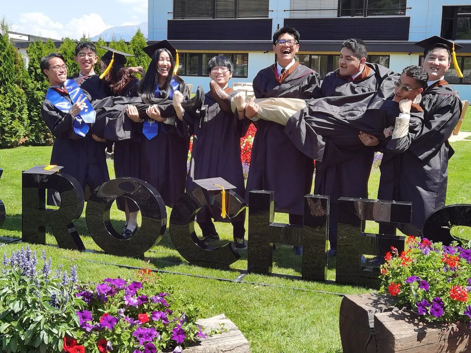 AIHM transfer students celebrating graduation at Les Roches, completing their final two semesters in Switzerland as part of the global hospitality management pathway.