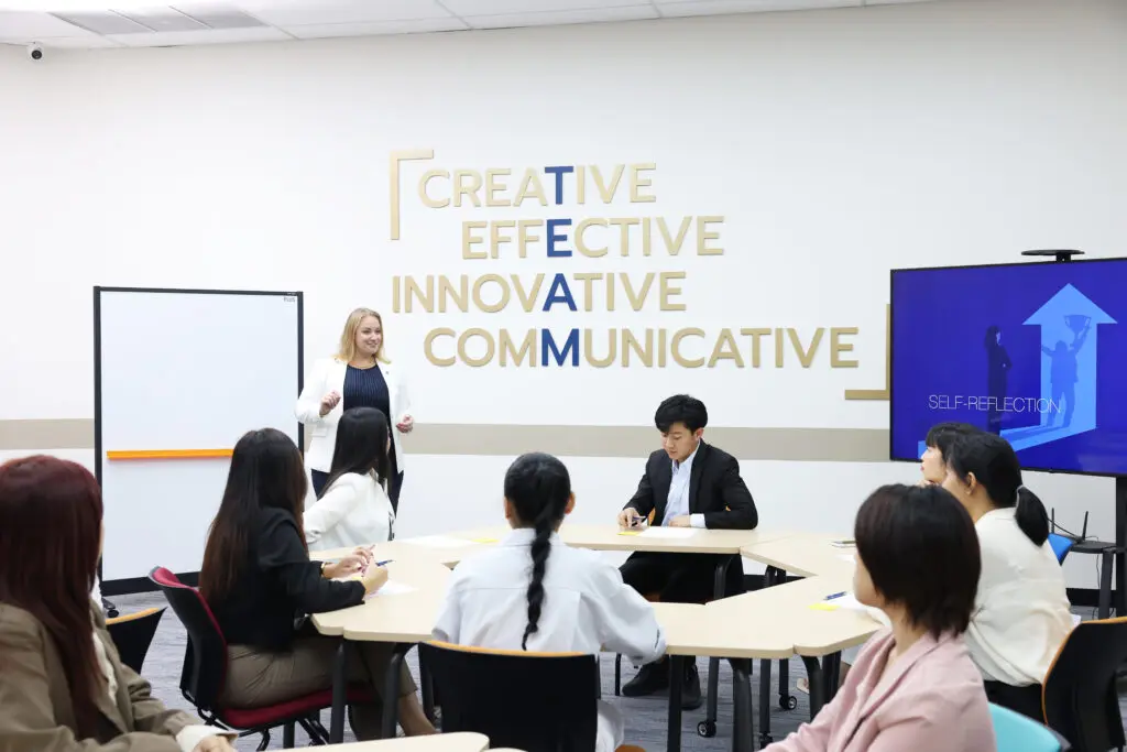 AIHM Executive Education short course training session, featuring professionals engaged in leadership development, self-reflection, and innovative hospitality skills learning in a creative and communicative classroom environment