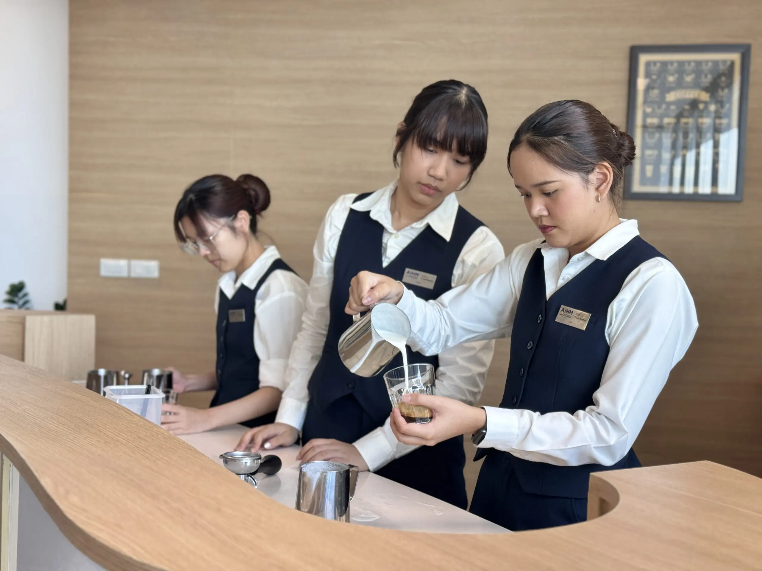 AIHM students learning barista and beverage service as part of the Practical Arts course in the Swiss-inspired BBA in Global Hospitality Management.