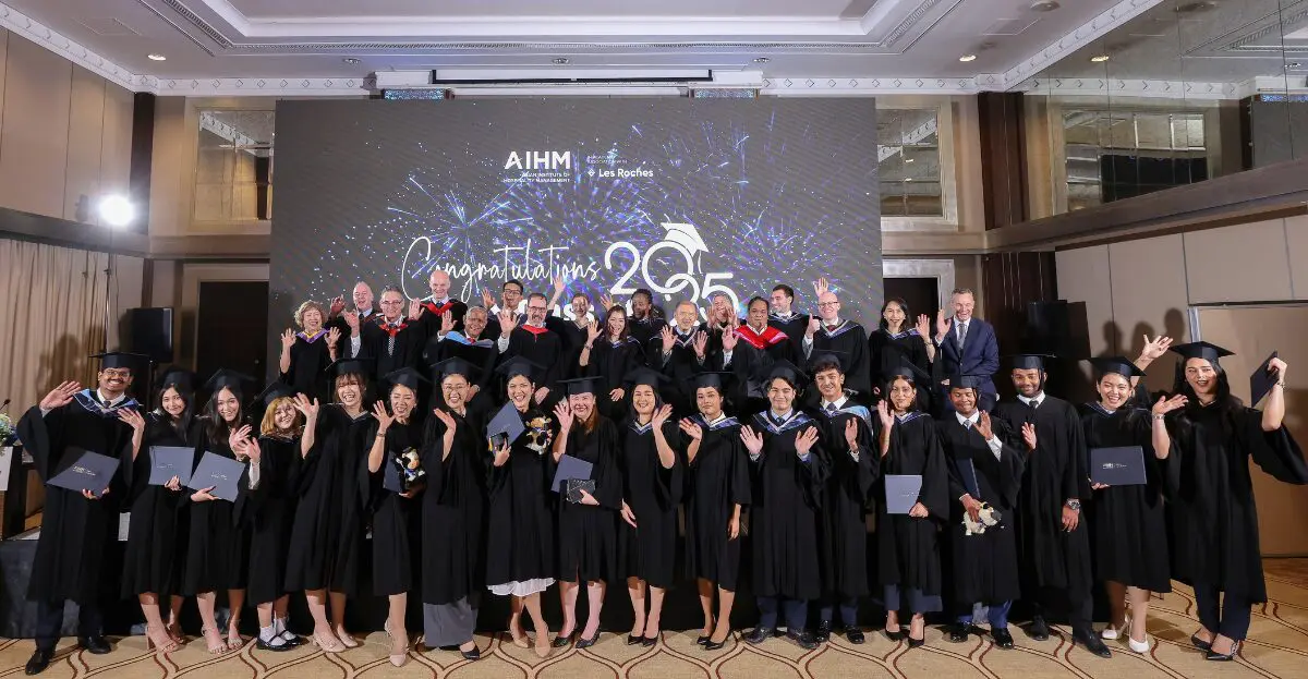AIHM graduates and faculty celebrate the Class of 2025 ceremony in Bangkok, honouring success in global hospitality education with Les Roches partnership.
