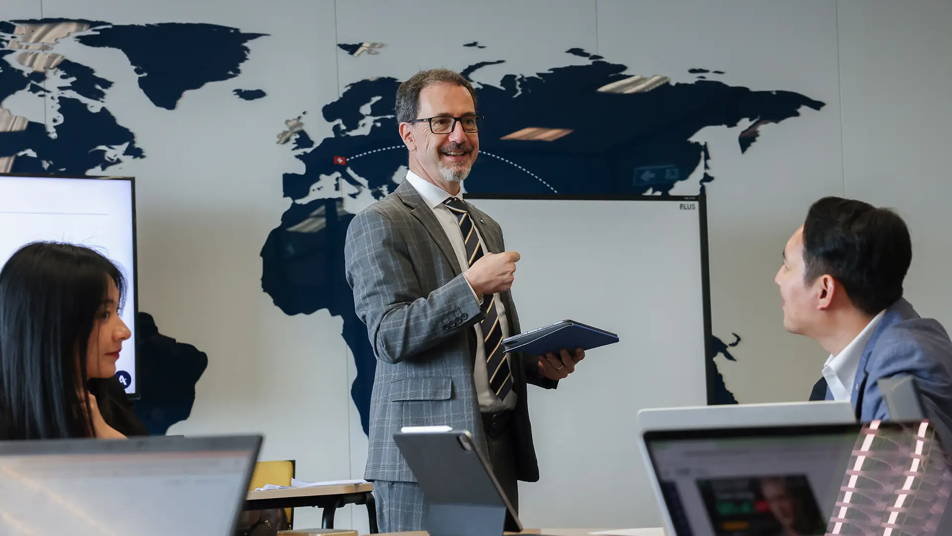 Lecturer teaching hospitality leadership and business strategy to postgraduate students at AIHM Bangkok during the Postgraduate Diploma in International Hospitality Management programme.