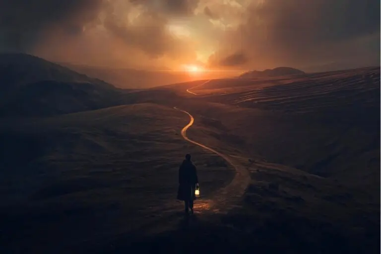 Person walking toward sunrise with a lantern, symbolising how to plan your career with clarity and purpose.