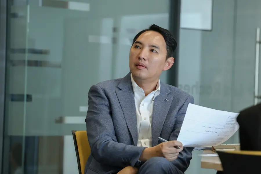 Professional participant in AIHM PGD programme analysing business case study, building strategic management and hospitality leadership expertise.
