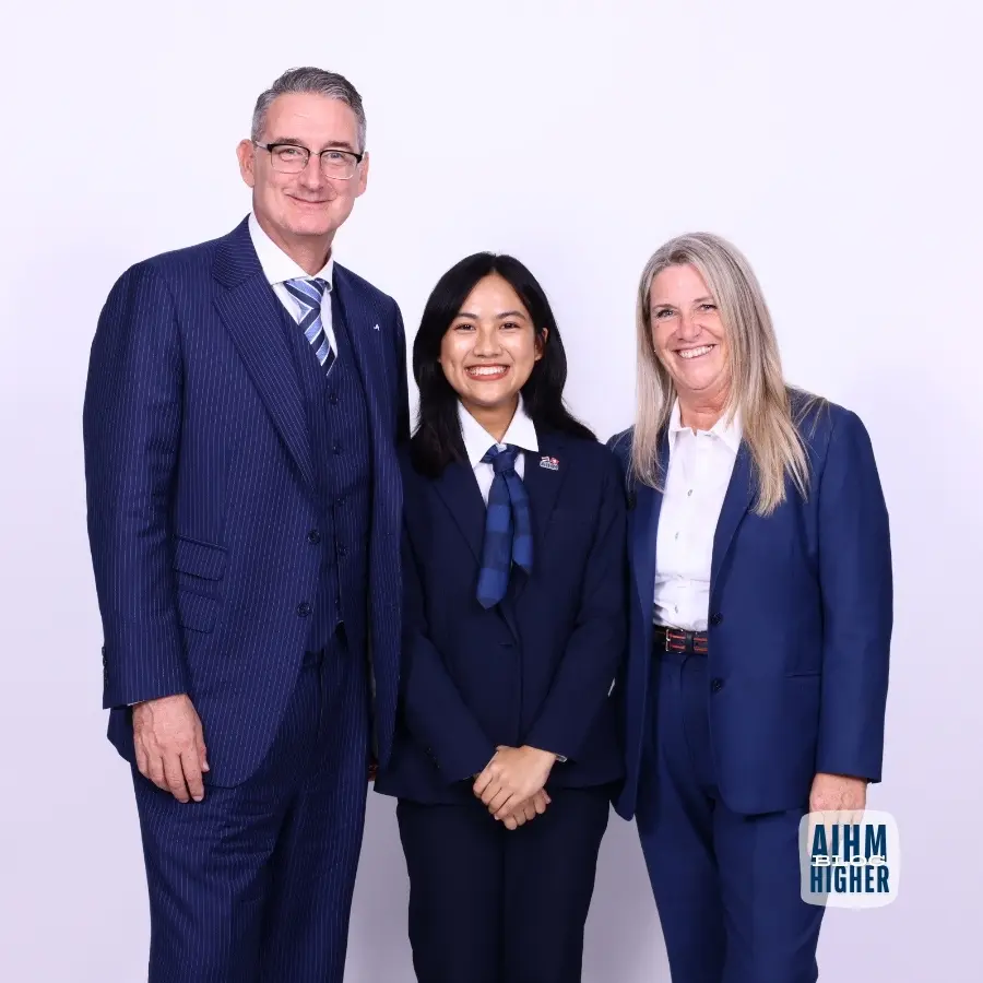 Hospitality student with lecturers at AIHM during first days at hospitality school