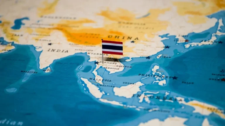 Map of Asia with a Thailand flag.
