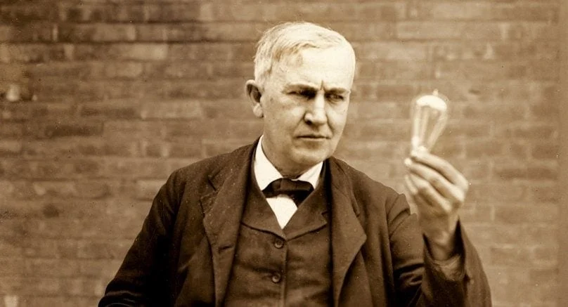 Thomas Alva Edison holding an incandescent lightbulb c1911 1