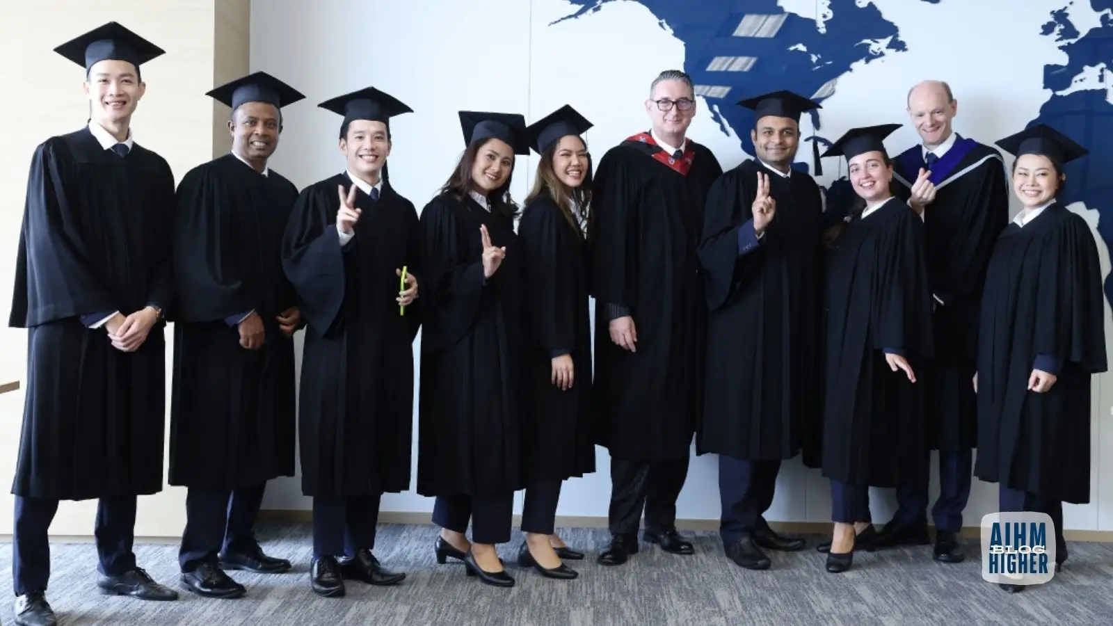 AIHM Certificate in International Hotel Administration graduates posing with Warren Stanworth and faculty members