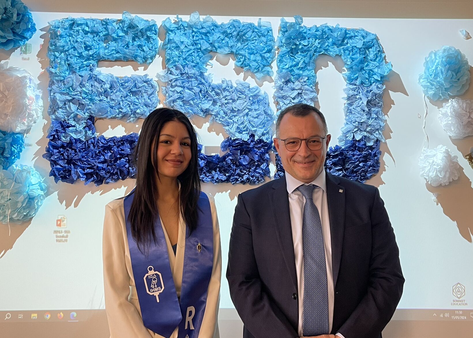 AIHM BBA hospitality management student celebrating academic achievement with Les Roches leadership, representing global pathways, international education, and hospitality excellence.