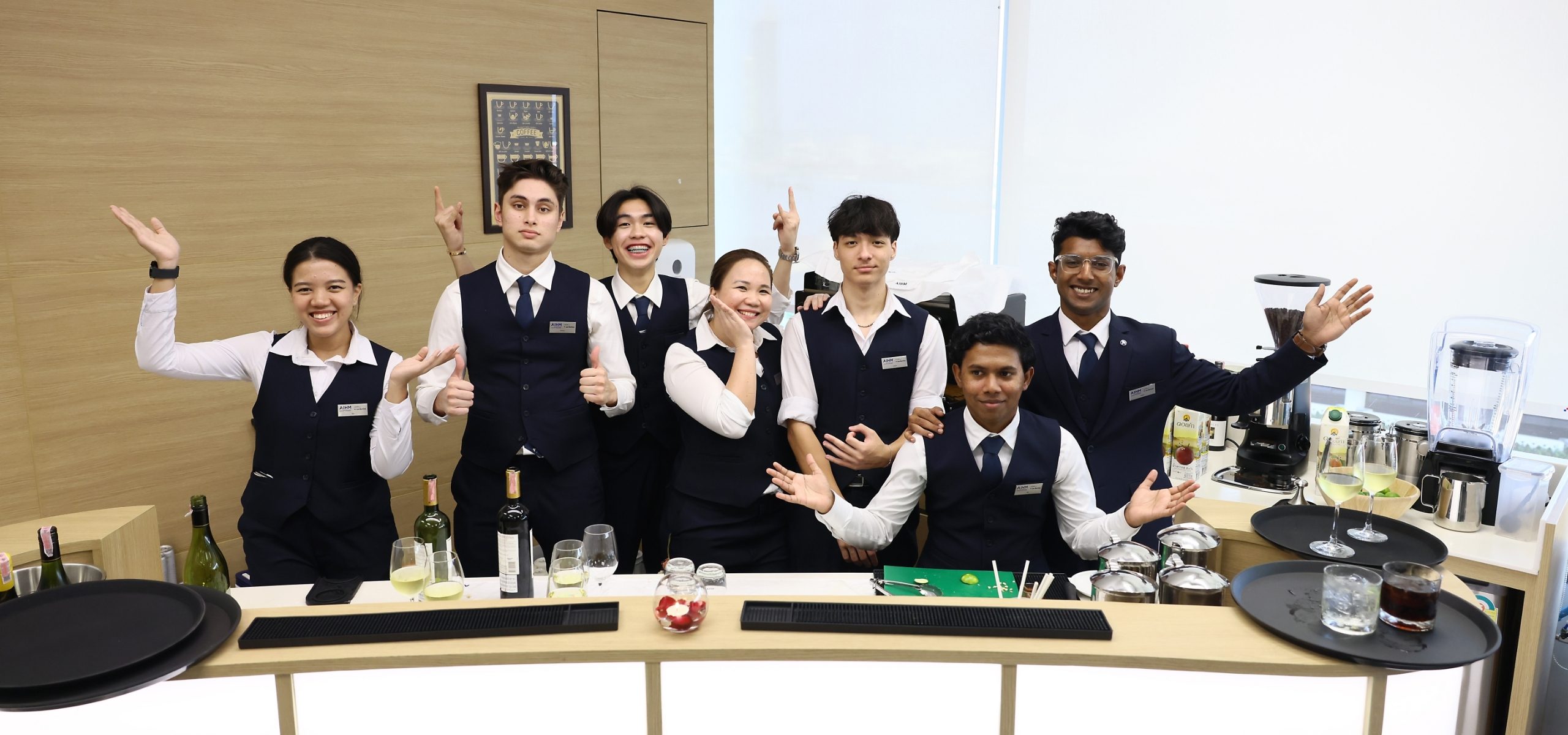 International BBA hospitality management students at AIHM practice mixology and bar service skills as part of practical arts training in academic association with Les Roches in Thailand.