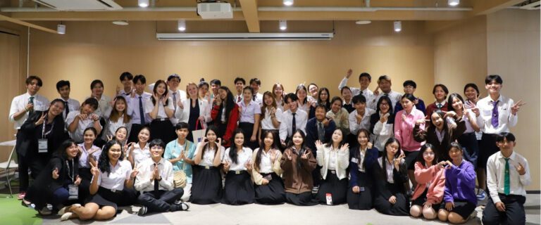AIHM representative Samantha leads AMCHAM camp workshop in Bangkok with students, showcasing interactive learning, teamwork, and hospitality leadership development