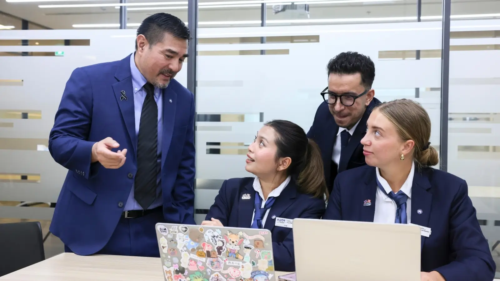 AIHM students presenting hospitality concepts in a certificate programme, developing communication and leadership skills in Bangkok