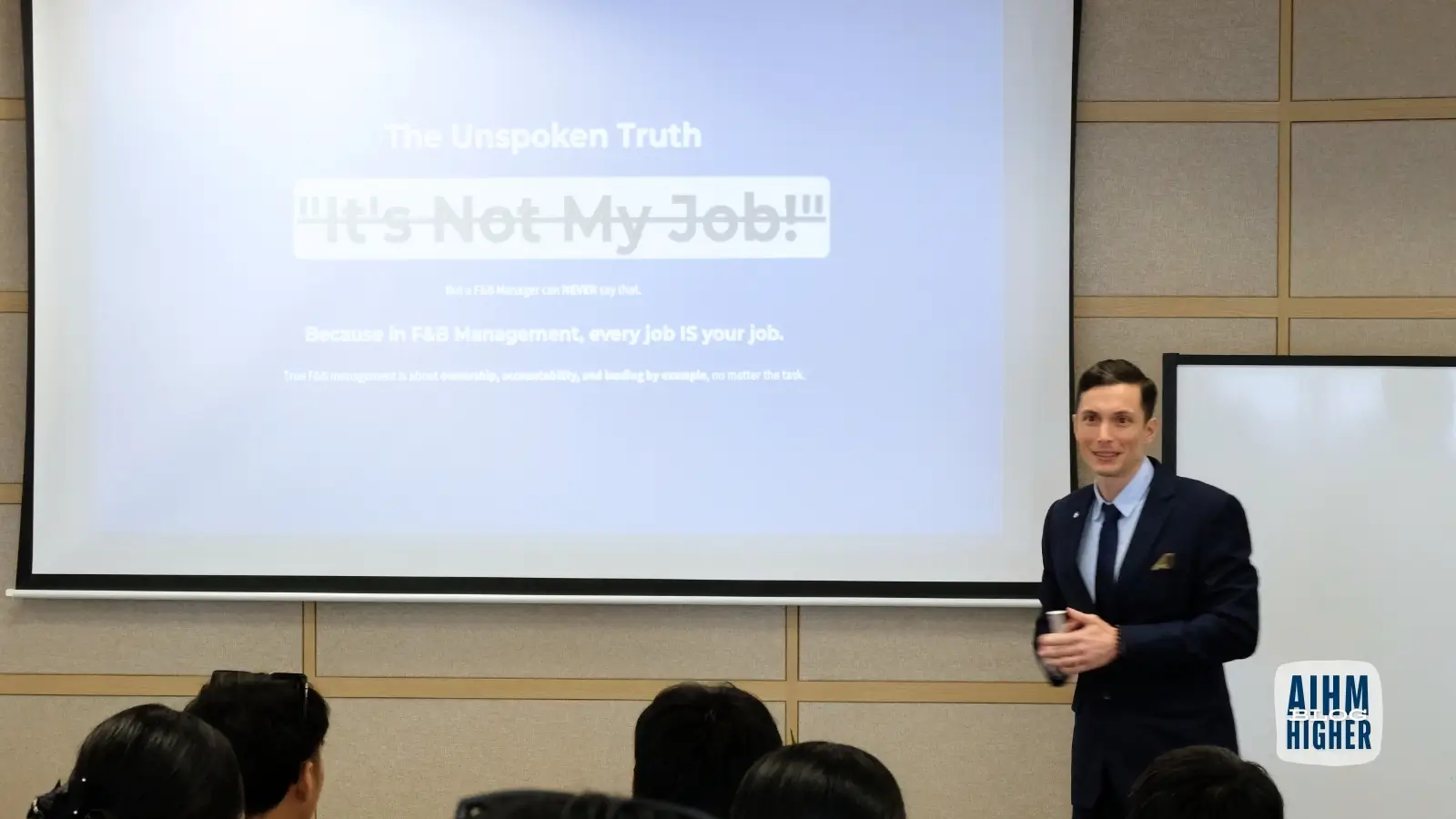 Hospitality lecturer teaching food and beverage management mindset to students at AIHM Bangkok