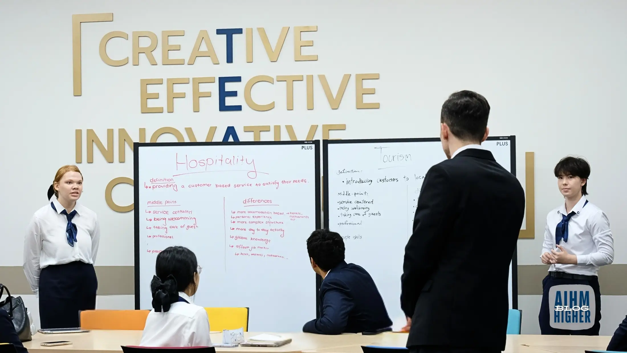 Hospitality students presenting service concepts in classroom at AIHM Bangkok
